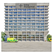 The outside of a large hospital building with an ambulance outside the door.