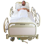 A man sitting up in a hospital bed 