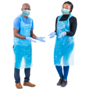 Two nurses wearing aprons, gloves and face coverings