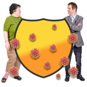 Two people standing either side of a yellow shield which has coronavirus germs 
