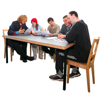 A group of people around a meeting table