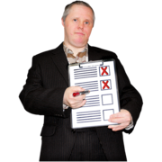 A man holds up a clipboard with red crosses on it