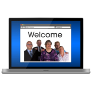 A laptop screen showing a group of people and the word welcome.