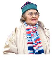 A lady wearing a hat and a scarf.