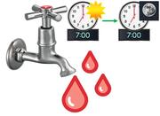 A tap with hot water.  Behind it is a clock showing 7 o' clock in the morning and a clock showing 7 o'clock in the evening.