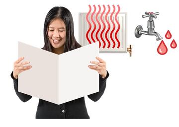 A lady reading a book with a hot radiator and a tap with hot water behind her.