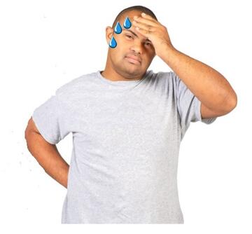 A man with drops of sweat running off his forehead.