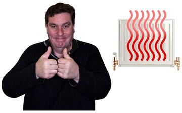 A man smiling with his thumbs up.  Behind him is a radiator with heat coming from it.