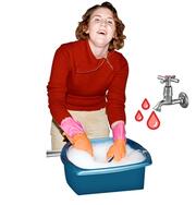 A lady washing up and a tap with hot water coming from it.