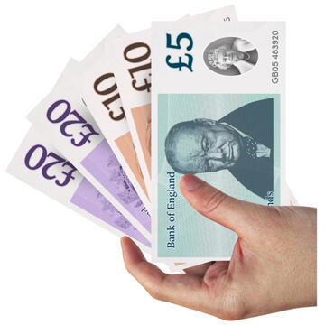 A hand holding some pound notes.