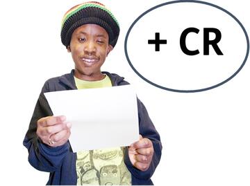 A man looking at a piece of paper with a + and CR beside him.