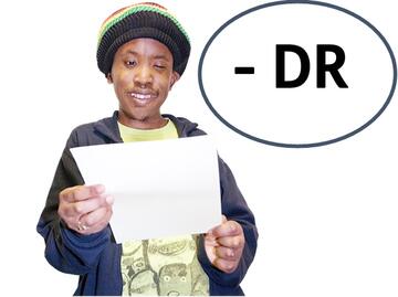 A man looking at a piece of paper with a - and DR beside him.