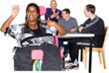 A group of people with learning disabilities around a meeting desk