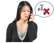 A lady talking on the phone.  Beside her is a speech bubble with a tap and a red cross through it.