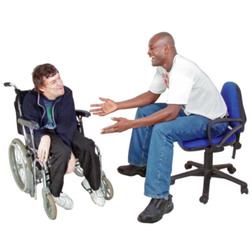 A man is sitting on a chair explaining something to a man in a wheelchair