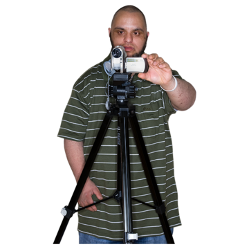 A man using a camera on a tall tripod