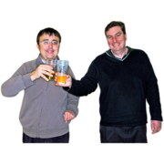 Two men tapping their beer glasses together 