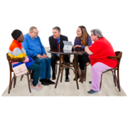 Five people sit at a table talking.