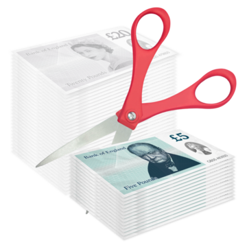 A pair of scissors is cutting a pile of pound notes