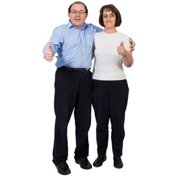 A man with his arm around a woman. Both have their thumbs up