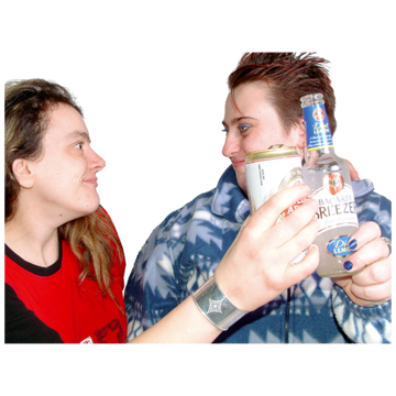 Two women are looking at each other and smiling. They are clinking their drinks together