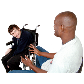 A man is talking to another man who is in a wheelchair