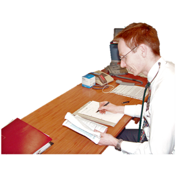 A doctor is reading something and writing things down