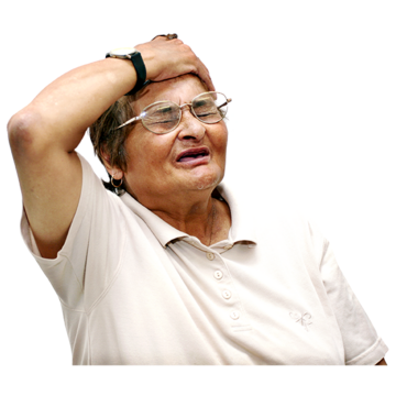 A woman putting the palm of her hand on her head. She is wearing glasses and looks in pain or sad
