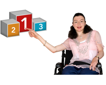 A young woman in a wheelchair is pointing to the first position on a podium