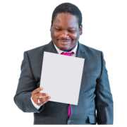 A man in a suit reads from a piece of paper. He is smiling.