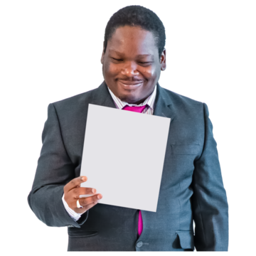 A man in a suit reads from a piece of paper. He is smiling.
