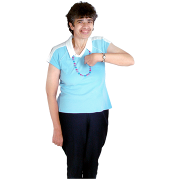 A woman in a blue top points at herself