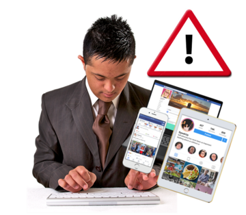 A man typing on social media with a safety warning sign above hime