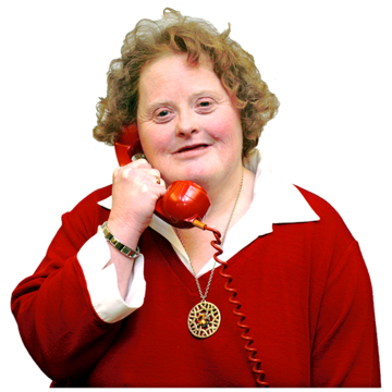 A woman holds a red telephone against her ear