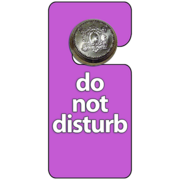 A do not disturb sign hangs from a door knob