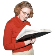 A woman reading from a book.