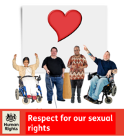 A group of people with disabilities in front of a poster with a heart symbol on it