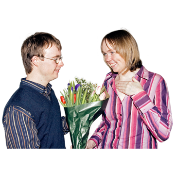 A young man giving a bouquet of flowers to a  young woman