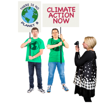 A woman is taking photographs of two activists who are holding up placards about climate change