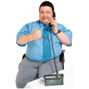 A man sat down on the telephone. He is smiling and is giving a thumbs up sign.