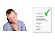A man on a phone next to a job offer letter.