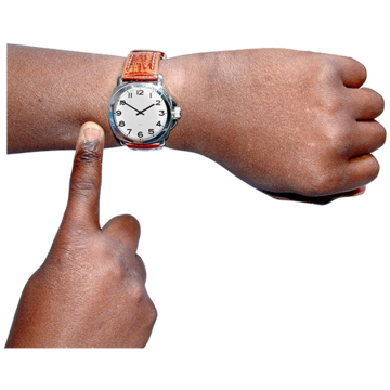 A finger points to a watch on the other hand
