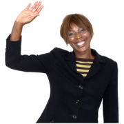 A picture of a woman in a suit. She is smiling and waving.