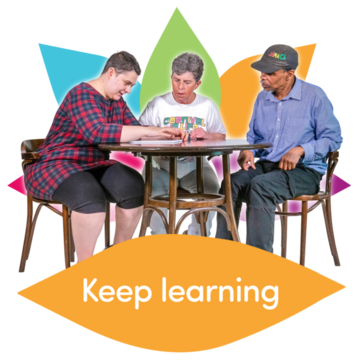 Three people sat a desk. A caption underneath says 'Keep learning'.