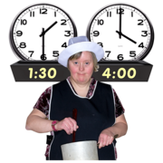 A woman works in a kitchen. Two clocks behind her indicate that she is working between the hours of 1:30 and 4:00. 