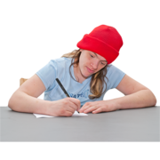 A woman in a red beanie hat is writing something down at a desk
