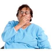 An older woman yawning in her hand