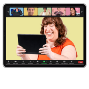 A woman holding a tablet having an online meeting with 5 people