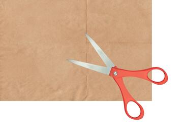 A sheet of non stick baking paper and a pair of scissors.