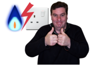 A man smiling with his thumbs up beside a gas flame and an electric socket.